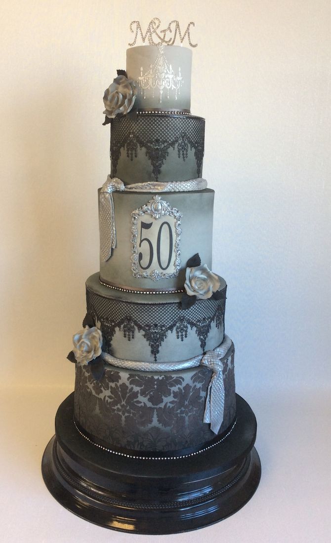 Grey 50th celebration cake with black lace and silver sugar roses