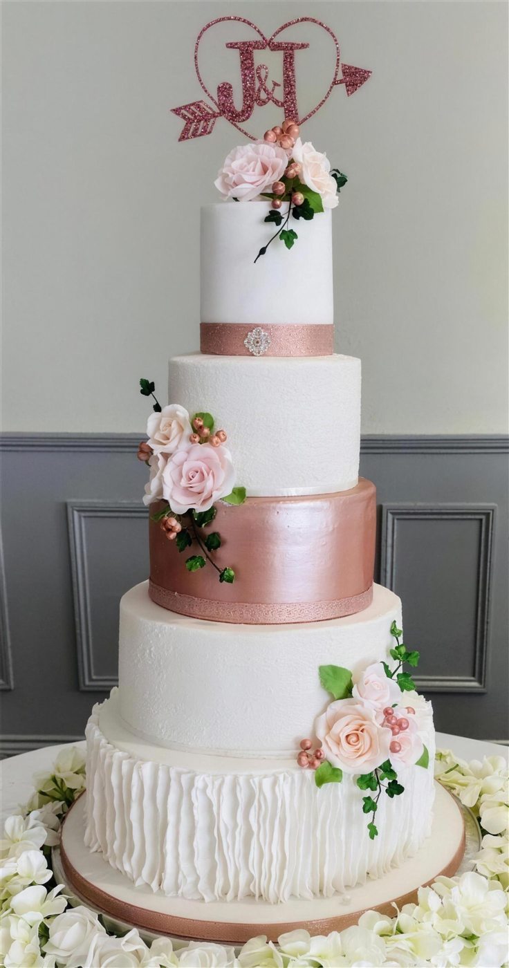 Rose gold tiered wedding cake with sugar roses