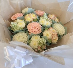 12 cupcake bouquet with piped buttercream flowers, wrapped as a gift bouquet